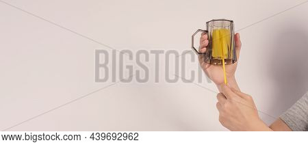 Clean And Wash Dish Concept. Man Hand Washing Drink Glass On White Background.