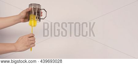 Clean And Wash Dish Concept. Man Hand Washing Drink Glass On White Background.