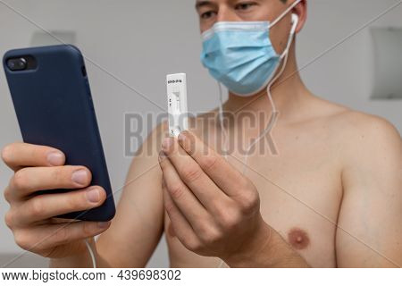 Man Showing Negative Rapid Antigen Test Result