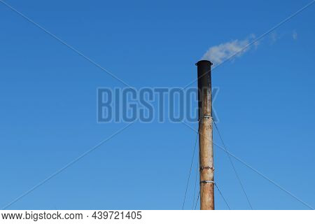A Sooty, Soot-covered Pipe Of A Coal Boiler House.