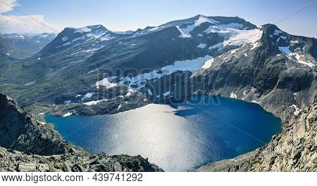Hiking On The Norwegian Mountain Bispen Above Bispevatnet And Trollstigen Street. Travel In Scandina