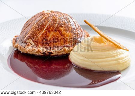 Tenderloin with pork, mushrooms and sirloin puff pastry on a white background. Homemade meal for wellington.
