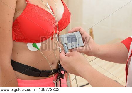 Electrocardiography Ecg Leads For A Portable Heart Monitor On An Young Woman Patient. The Nurse Conn
