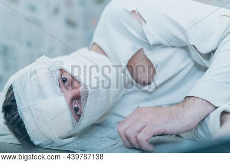 Victim Of Tabloid Journalism And Fake News Infodemic, Conceptual Image Of Man Wrapped In Bandages Su