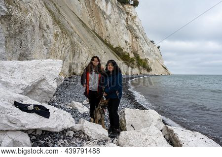 A Mother And Daughter With A Dog In Front Of A Beautiful Chalk Cliff. Picture From Mons Klint In Den