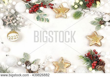 Christmas And New Year Frame Made Of Decorations, Fir Branches And Cones, Winter Composition With Pl