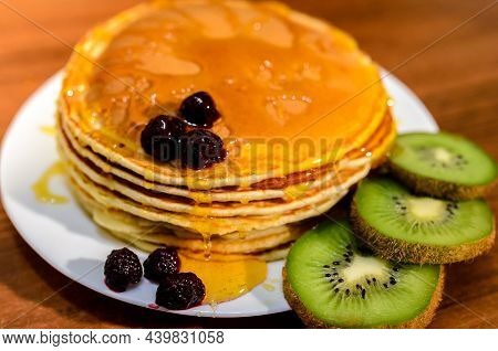 Delicious Pancakes With Honey, Kiwi And Berries.
