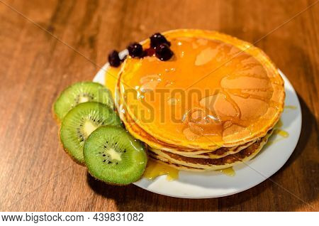 Delicious Pancakes With Honey, Kiwi And Berries.
