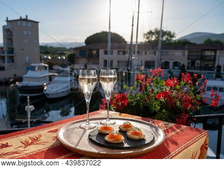 Russian Style Party With Two Glasses Of White Cold Champagne, Bliny With Red Caviar And View On Port