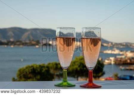 Summer Party, Drinking Of French Champagne Rose Sparkling Wine In Glasses With View On Fishermen Har