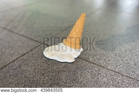 An Icecream That Has Fallen To The Ground
