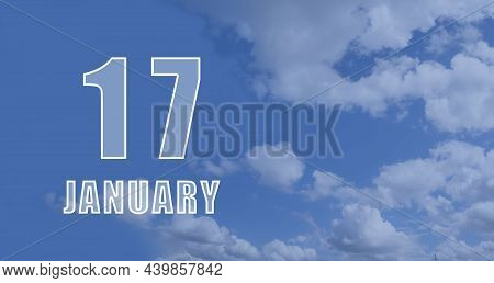 January 17. 17-th Day Of The Month, Calendar Date.white Numbers Against A Blue Sky With Clouds. Copy