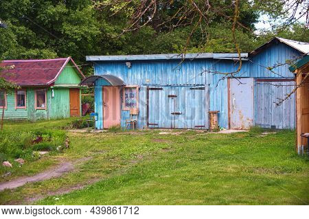 Small Old Wooden Huts In The Village