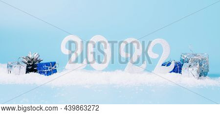 New Year 2022, Banner Greeting Card Layout. Festive Composition Of Numbers 2022 New Years Toys On A 