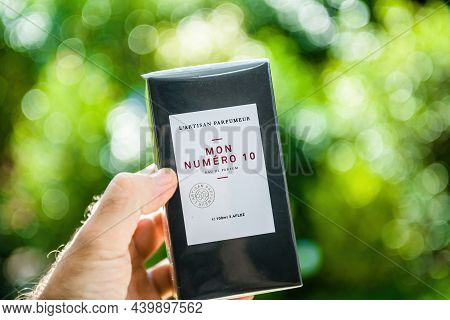 Paris, France - Sep 8, 2021: Pov Male Hand Holding New Package Of Luxury Mon Numero 10 Perfume Eau D