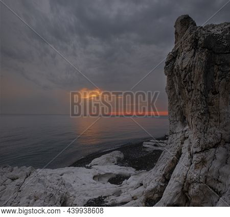 Beautiful Beach With White Rocks At Epic Sunset With Sunbeams Over The Sea