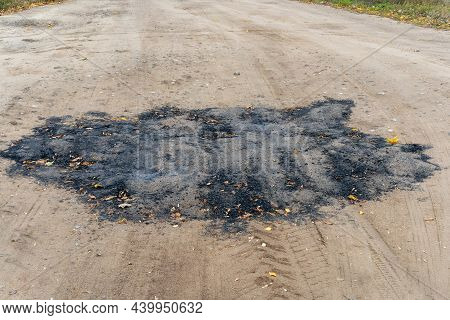 The Road Surface Is Defective. Poorly Laid Asphalt On The Road.