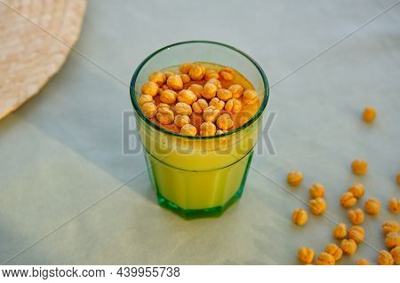 Boza Or Bosa, Bozo, Traditional Turkish Beverage With Leblebi. Malt Drink Made By Fermenting Maize A