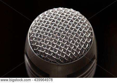 Professional Microphone In A Music Studio On A Black Background. Record Sounds And Songs. Chrome Met