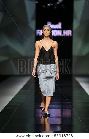 ZAGREB, CROATIA - OCTOBER 17: Fashion model wearing clothes designed by Petra Vuletic and Sasa Hortig on the 'Fashion.hr' show on October 17, 2013 in Zagreb, Croatia.