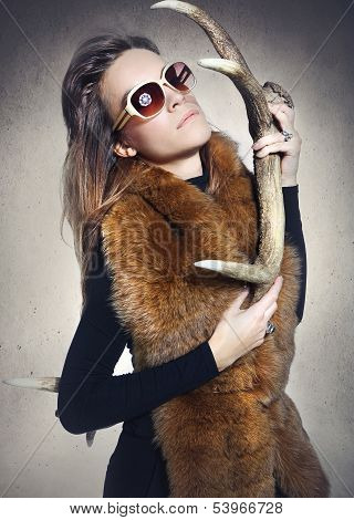 Sensual woman with a horn deer