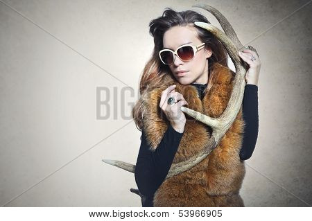 elegant woman with a horn deer