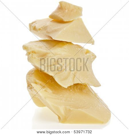 cocoa butter heap close up on white background 