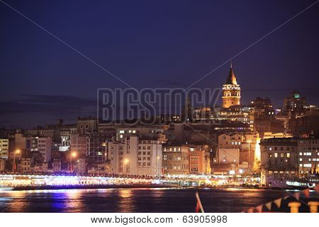 ISTANBUL, TURKEY - OCTOBER 20, 2010: Night view to Galata tower and Golden Horn. Built in 1348, now the tower are lovely place for tourists due to panoramic view to the old city