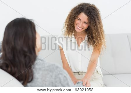 Therapist smiling at her patient at therapy session