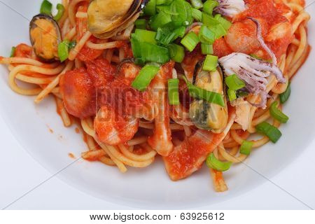 Pasta with shrimps, herbs and mashrooms isolated on white background in studio