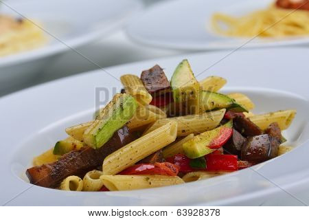 Pasta with shrimps, herbs and mashrooms isolated on white background in studio