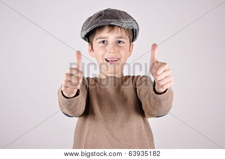 Young boy with thumbs up