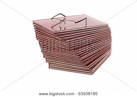 Pile of books and glasses