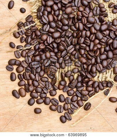 Fresh Coffee Beans On Wood Background