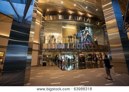 SINGAPORE - NOVEMBER 08, 2012: Fashionable shops on Orchard Road. The famous street of Orchard Road - this 2.2 kms street is the retail and entertainment hub of Singapore and major tourist attraction.