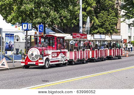 Touristic train in Lugano waiting for tourists to carry them around