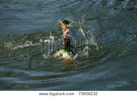 Asian Children Bath On Vietnamese River