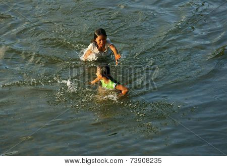 Asian Children Bath On Vietnamese River
