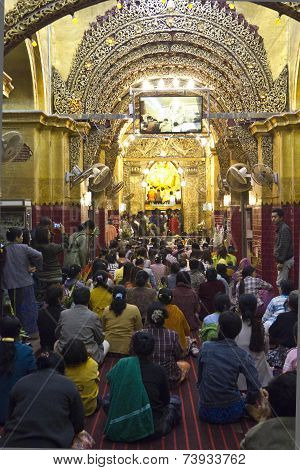 People Praying At The Buddha