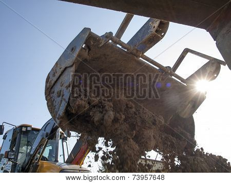 Wheel Loader During Backfilling Around The Foundation Of The Building