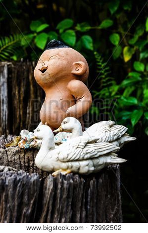 Ceramic dolls in the garden