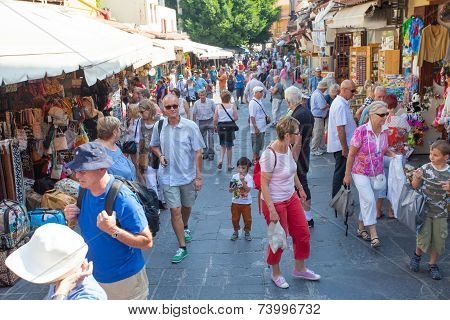Tourists and shoppers at Rhodes old city centre shopping street