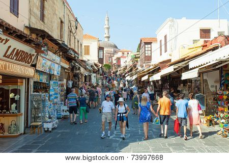 Tourists and shoppers at Rhodes old city centre shopping street