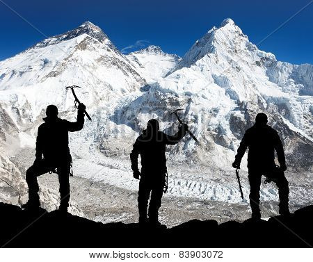 Silhouette Of Men With Ice Axe In Hand, Mount Everest