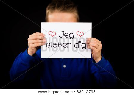 Child Holding Sign With Danish Words Jeg Elsker Dig - I Love You
