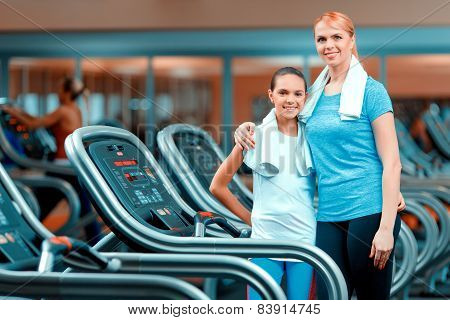 Cute teenage girl and her mom at sports club