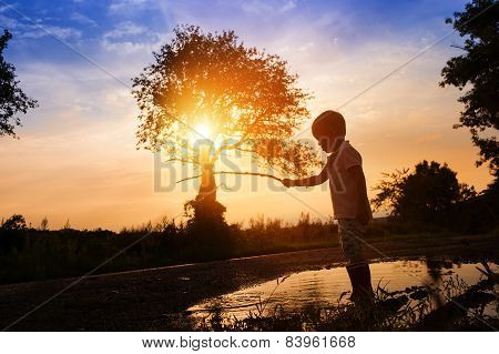Boy in a puddle
