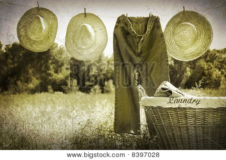 ภาพ Grunge เก่าของกางเกงยีนส์และหมวกฟาง