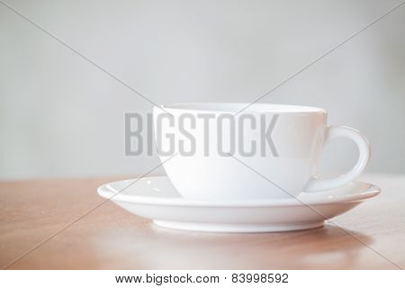 White Coffee Cup On Wooden Table