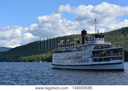 LAKE GEORGE, NY - SEP 24: Cruises around Lake George in New York State, as seen on Sep 24, 2016. The lake lies within the upper region of the Great Appalachian Valley and drains all the way northward into Lake Champlain and the St. Lawrence River drainage